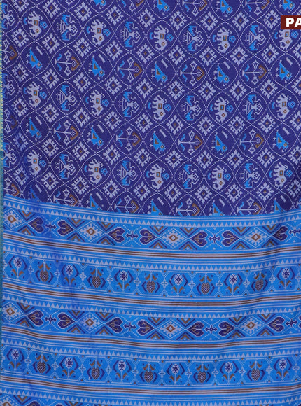 Semi tussar saree blue and cs blue with allover patola prints and ikat woven zari border