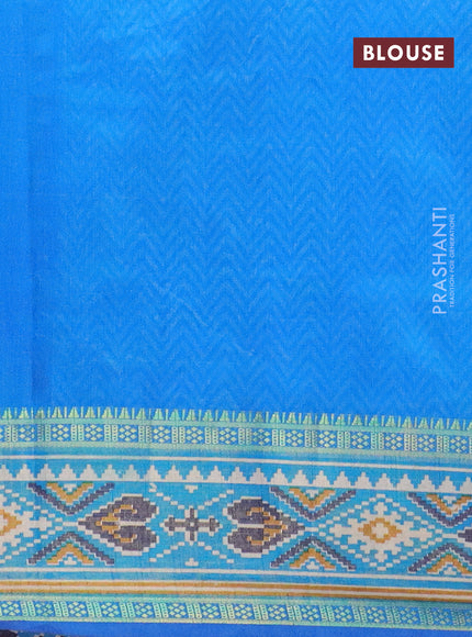 Semi tussar saree blue and cs blue with allover patola prints and ikat woven zari border