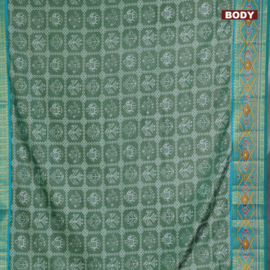 Semi tussar saree green shade with allover patola prints and ikat woven zari border