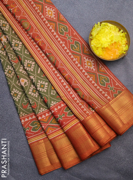 Semi tussar saree green shade and rust shade with allover patola prints and zari woven border