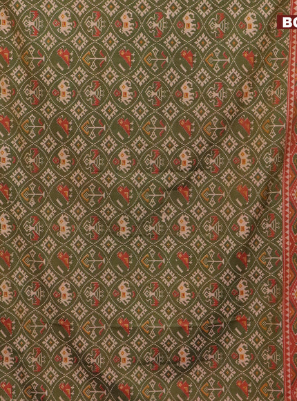 Semi tussar saree green shade and rust shade with allover patola prints and zari woven border