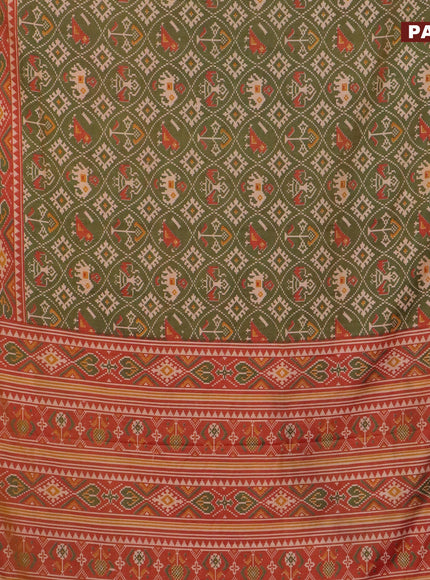 Semi tussar saree green shade and rust shade with allover patola prints and zari woven border