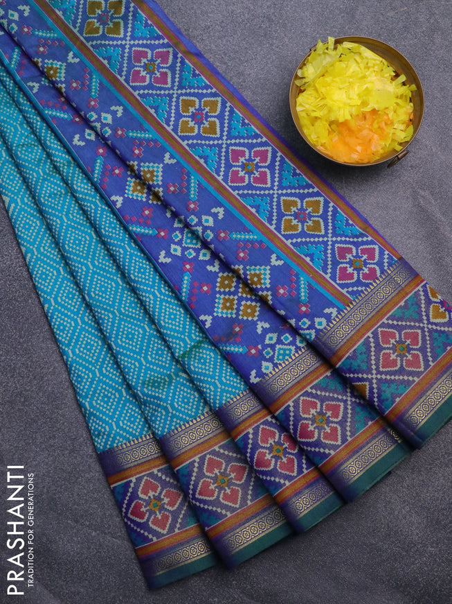 Semi tussar saree dual shade of cs blue and dual shade of blue with allover ikat prints and ikat woven zari border