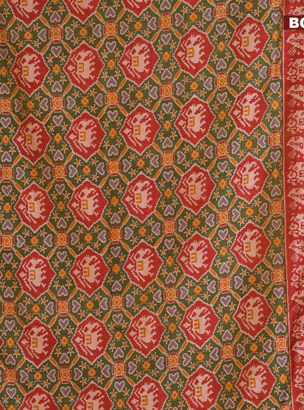 Semi tussar saree sap green and rust shade with allover patola prints and zari woven border