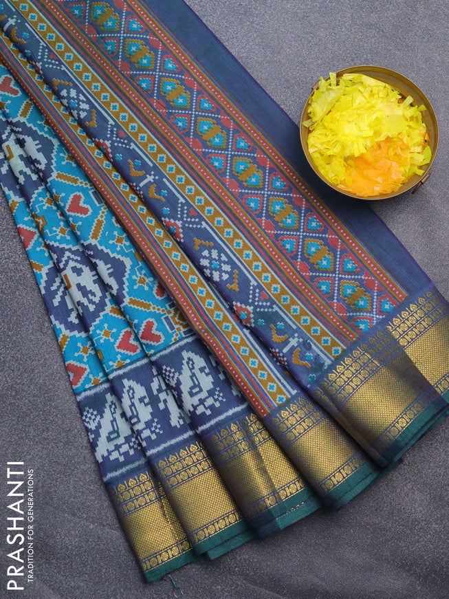 Semi tussar saree teal blue and green with allover patola prints and zari woven border