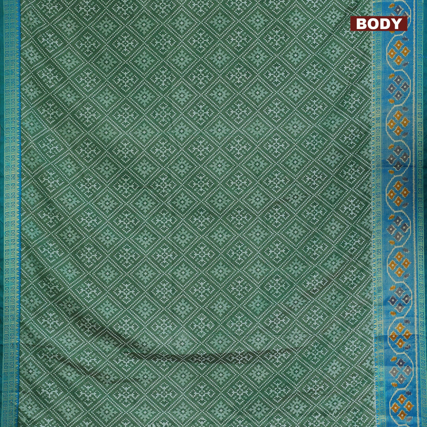 Semi tussar saree green and cs blue with allover ikat prints and ikat woven zari border