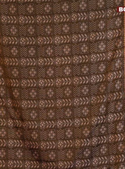 Semi tussar saree dual shade of brown and dual shade of rust with allover ikat prints and ikat woven zari border