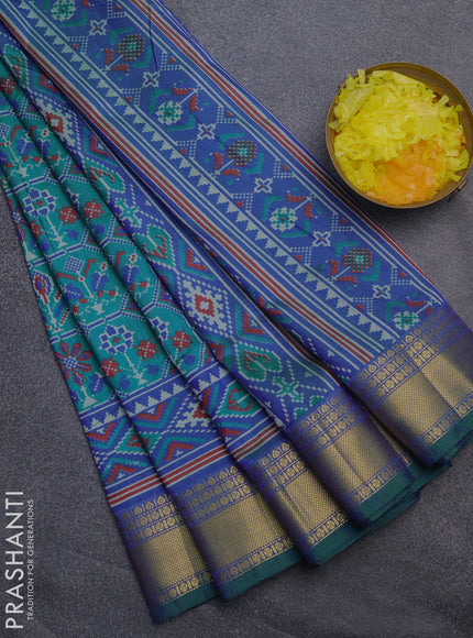 Semi tussar saree teal bluish green and blue with allover ikat prints and zari woven border