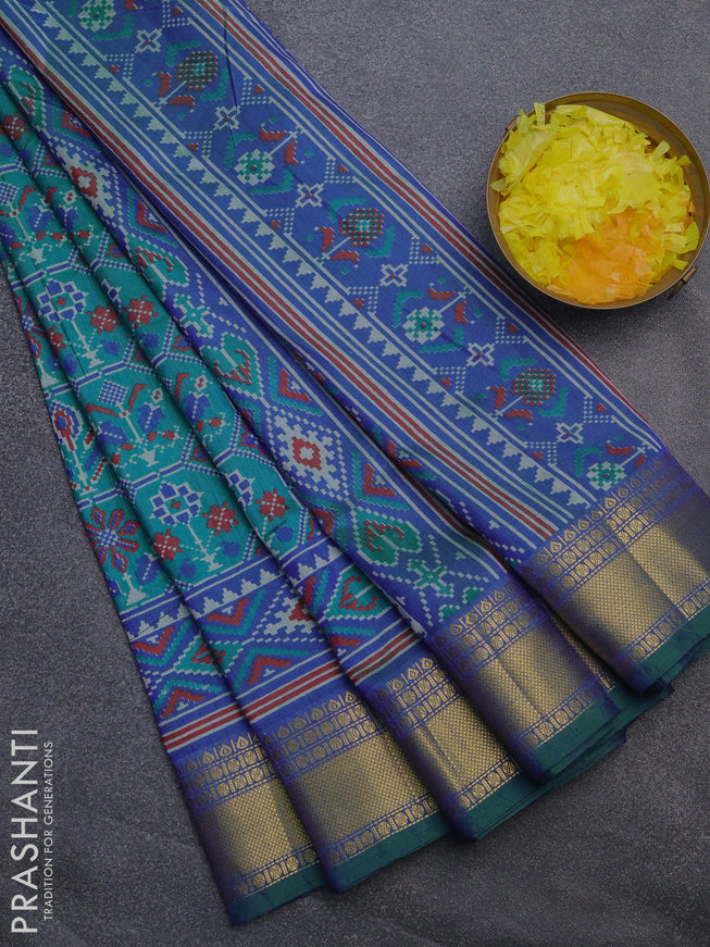 Semi tussar saree teal bluish green and blue with allover ikat prints and zari woven border