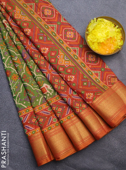 Semi tussar saree dual shade of green and dual shade of rust with allover ikat prints and zari woven border