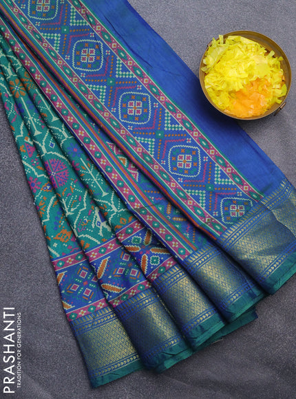 Semi tussar saree dual shade of green and dual shade of teal blue with allover ikat prints and zari woven border