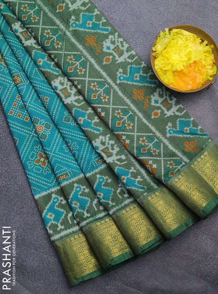 Semi tussar saree dual shade of teal blue and green with allover ikat prints and zari woven border