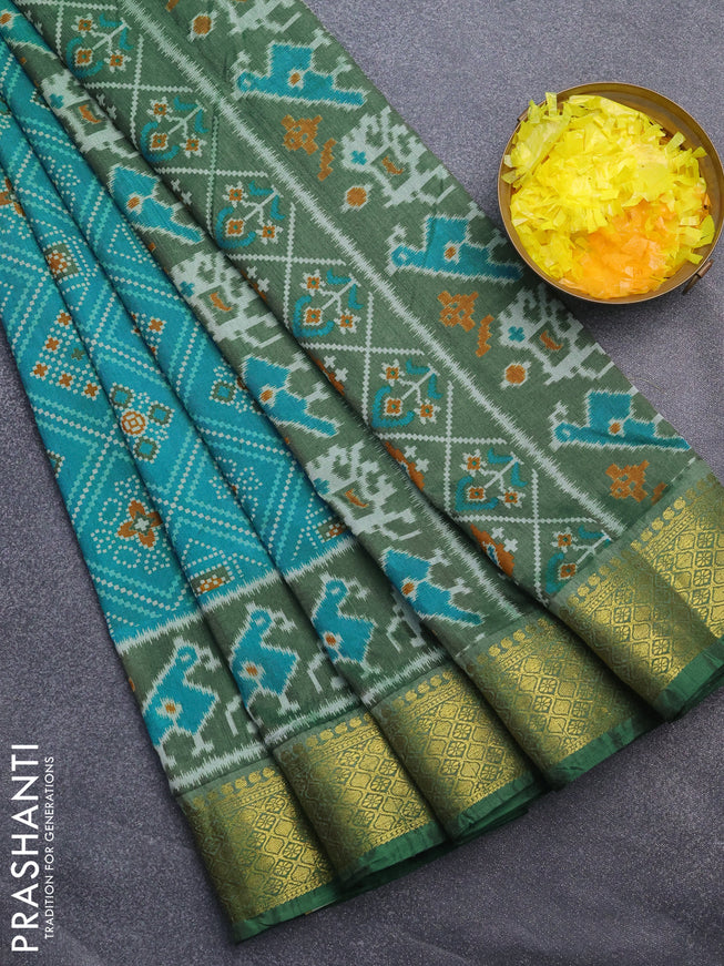 Semi tussar saree dual shade of teal blue and green with allover ikat prints and zari woven border