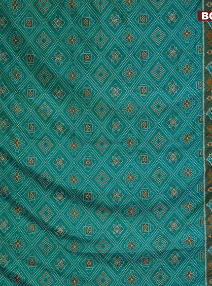 Semi tussar saree dual shade of teal blue and green with allover ikat prints and zari woven border