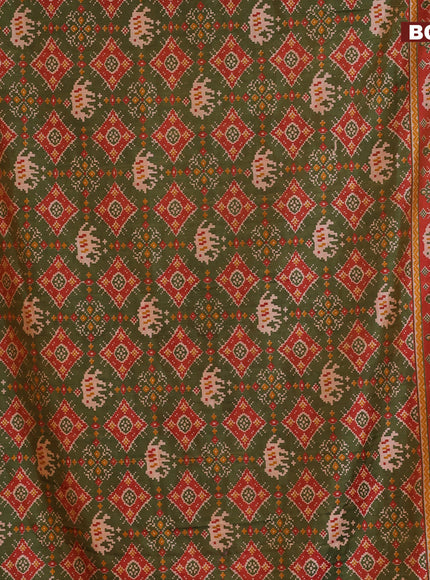 Semi tussar saree dual shade of green and dual shade of rust with allover ikat prints and zari woven border