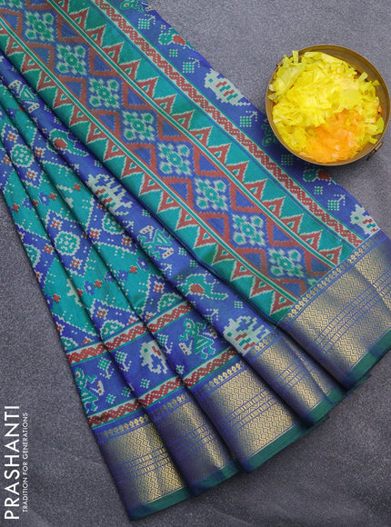 Semi tussar saree dual shade of teal blue and blue with allover ikat prints and zari woven border