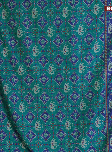 Semi tussar saree dual shade of teal blue and blue with allover ikat prints and zari woven border