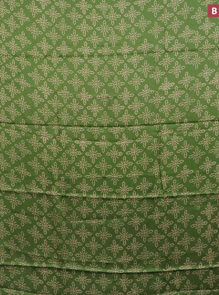 Modal silk saree green shade with allover prints and printed border