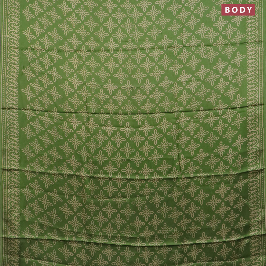 Modal silk saree green shade with allover prints and printed border