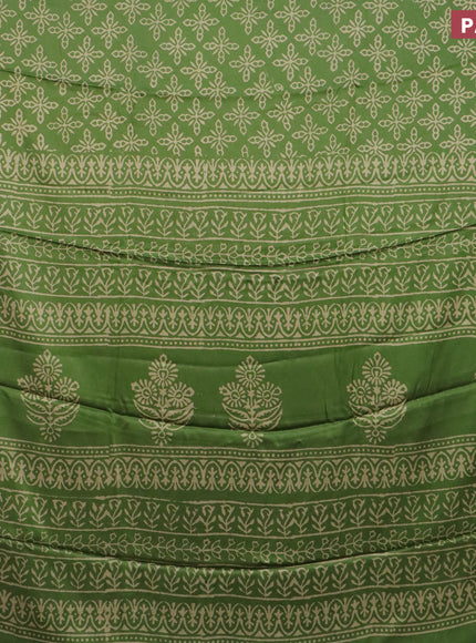 Modal silk saree green shade with allover prints and printed border