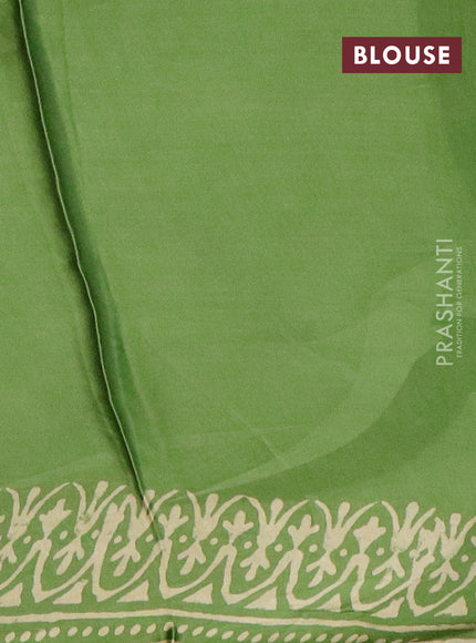 Modal silk saree green shade with allover prints and printed border