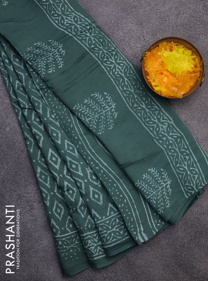 Modal silk saree green shade with geometric prints and printed border