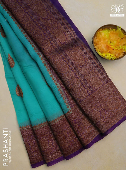 Banarasi organza silk saree teal green shade and purple with woven buttas and banarasi style border