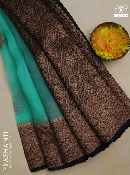 Banarasi organza silk saree teal green shade and black with woven buttas and banarasi style border