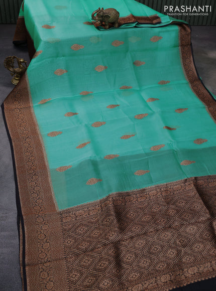 Banarasi organza silk saree teal green shade and black with woven buttas and banarasi style border