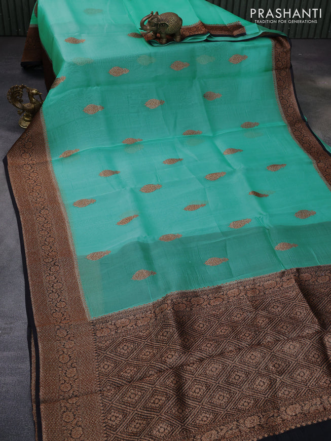 Banarasi organza silk saree teal green shade and black with woven buttas and banarasi style border