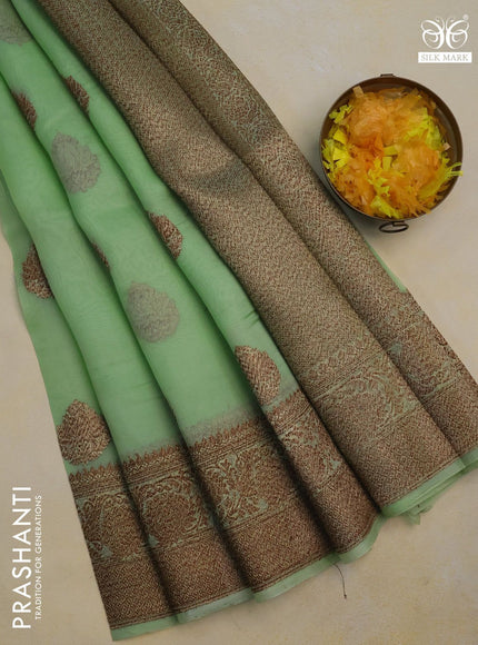 Banarasi organza silk saree pista green with woven buttas and banarasi style border