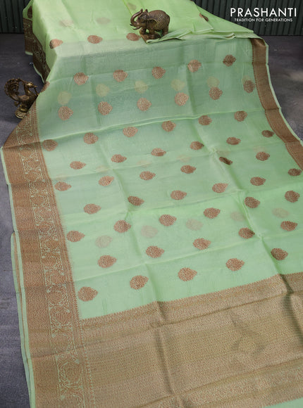 Banarasi organza silk saree pista green with woven buttas and banarasi style border