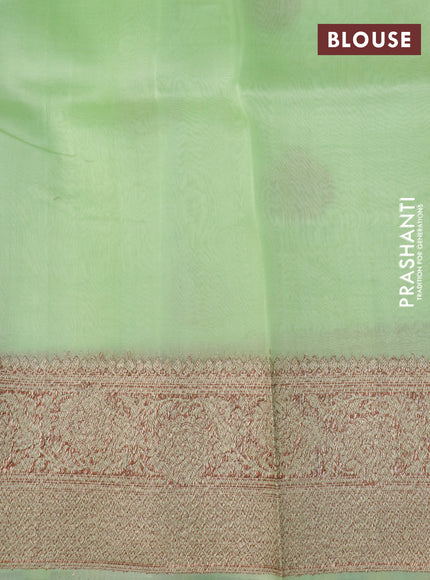 Banarasi organza silk saree pista green with woven buttas and banarasi style border