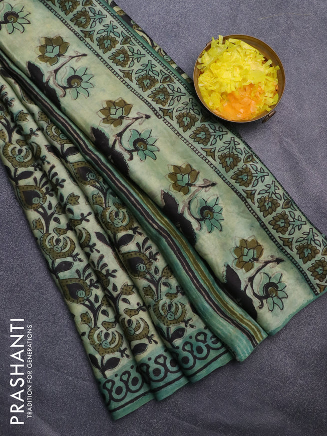 Modal silk saree green shade with allover kalamkari prints and printed border