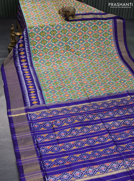 Pochampally silk saree green and blue with allover ikat weaves and ikat style zari woven border