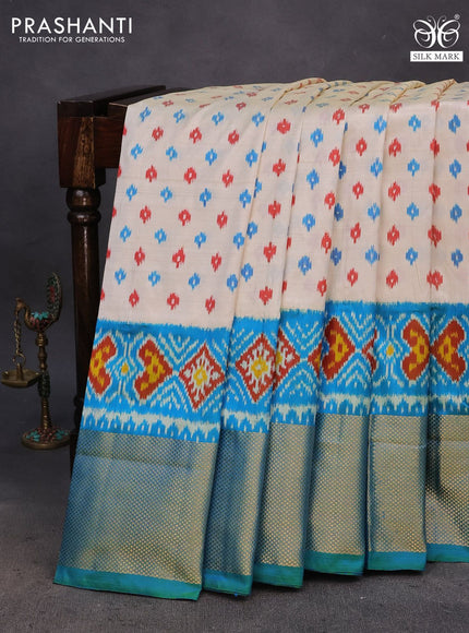 Pochampally silk saree cream and dual shade of bluish green with allover ikat butta weaves and ikat woven zari border