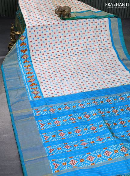 Pochampally silk saree cream and dual shade of bluish green with allover ikat butta weaves and ikat woven zari border