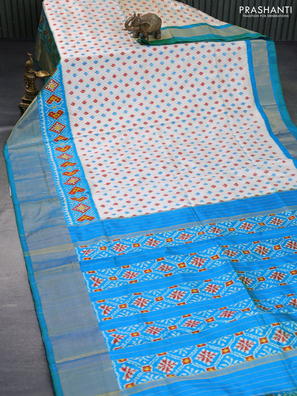 Pochampally silk saree cream and dual shade of bluish green with allover ikat butta weaves and ikat woven zari border