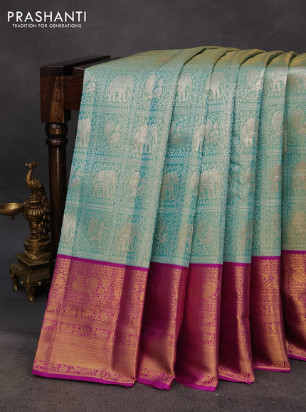 Pure kanchipuram tissue silk saree dual shade of teal blue and purple with allover silver zari woven brocade weaves and long rich zari woven border