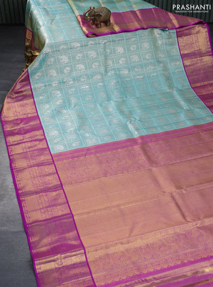 Pure kanchipuram tissue silk saree dual shade of teal blue and purple with allover silver zari woven brocade weaves and long rich zari woven border