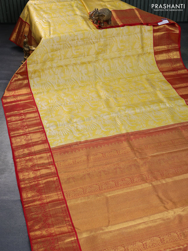 Pure kanchipuram tissue silk saree gold and red with allover silver zari woven brocade weaves and long rich zari woven border