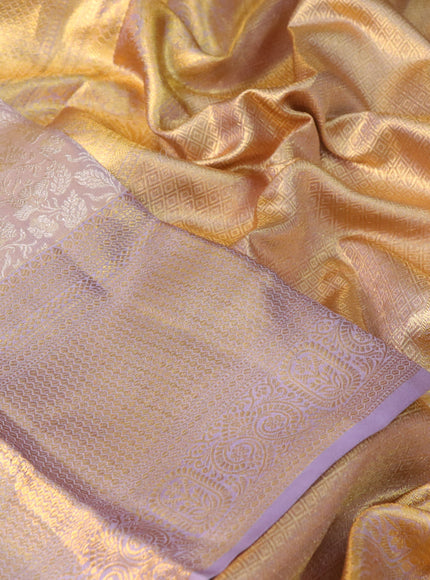 Pure kanchipuram tissue silk saree dual shade of gold and pastel lavender with allover silver zari woven brocade weaves and long zari woven border