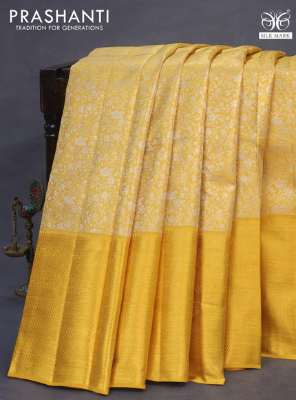 Pure kanchipuram tissue silk saree yellow with allover silver zari woven brocade weaves and long zari woven border