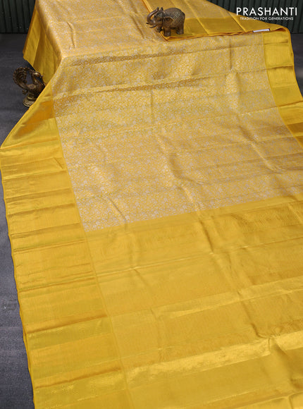 Pure kanchipuram tissue silk saree yellow with allover silver zari woven brocade weaves and long zari woven border