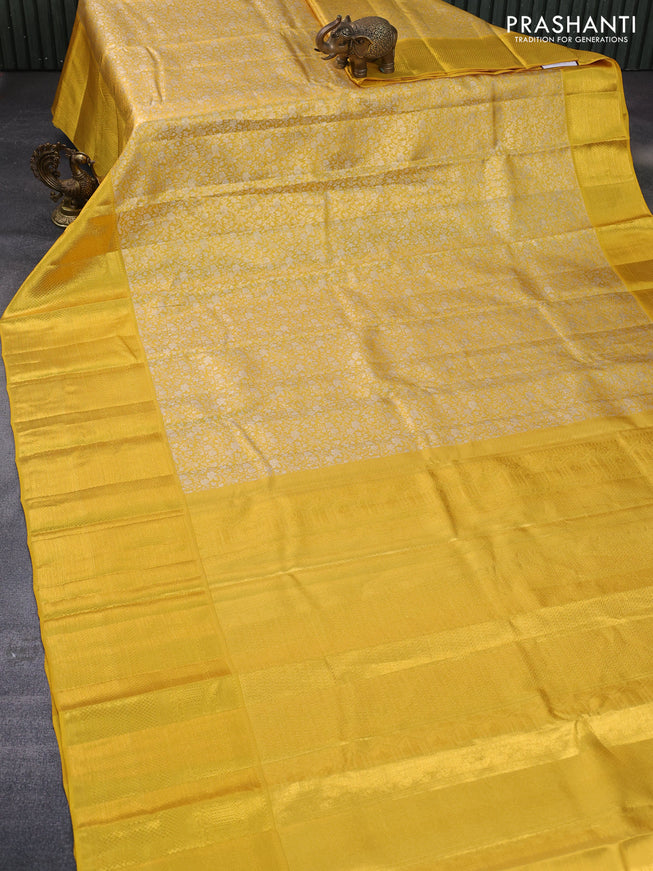 Pure kanchipuram tissue silk saree yellow with allover silver zari woven brocade weaves and long zari woven border