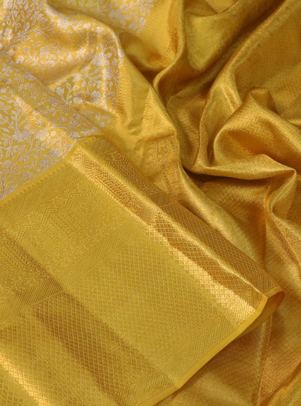 Pure kanchipuram tissue silk saree yellow with allover silver zari woven brocade weaves and long zari woven border