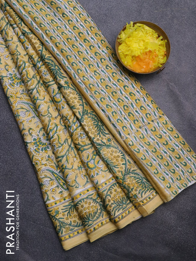 Modal silk saree yellow with allover kalamkari prints and printed border