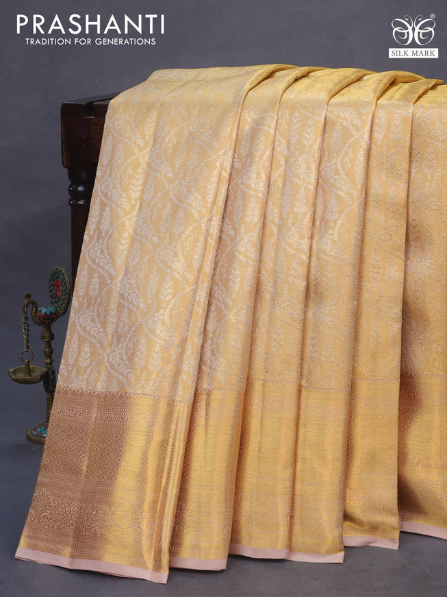 Pure kanchipuram tissue silk saree gold with allover silver zari woven brocade weaves and zari woven border