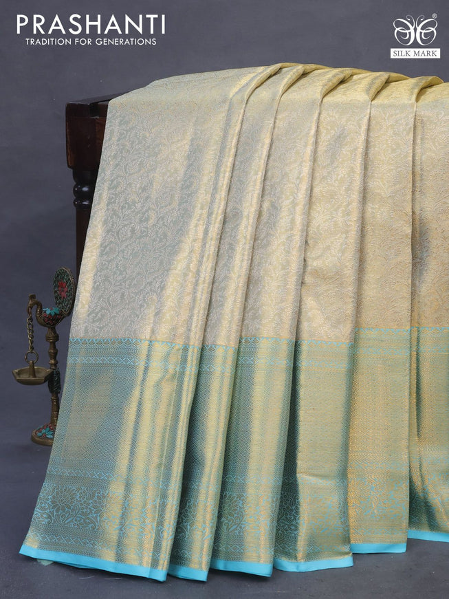 Pure kanchipuram tissue silk saree dual shade of pastel grey and light blue with allover zari woven brocade weaves and long zari woven border