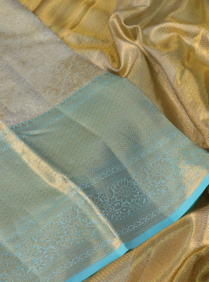 Pure kanchipuram tissue silk saree dual shade of pastel grey and light blue with allover zari woven brocade weaves and long zari woven border